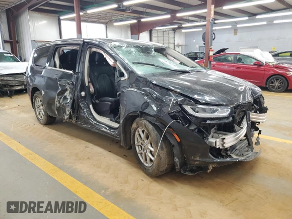2023 Chrysler Pacifica Touring L with VIN 2C4RC1BG3PR582271, listed as a Copart auction lot 51644595 with 57,930 mi miles and Salvage title. Bid and sale history available at DreamBid. Image 4.