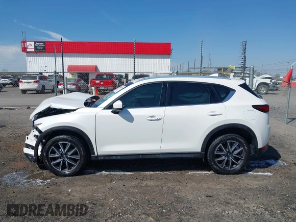 2018 Mazda CX-5 Grand Touring with VIN JM3KFBDM0J0404635, listed as a IAAI auction lot 41883068 with 71,178 mi miles. Bid and sale history available at carsss.com. Image 14.