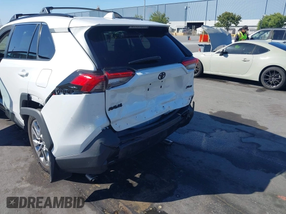 2023 Toyota RAV4 XLE Premium with VIN 2T3C1RFV7PW299428, listed as a IAAI auction lot 42527306 with 9,853 mi miles and . Bid and sale history available at DreamBid. Image 6.