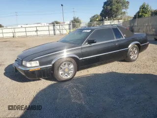 2001 Cadillac Eldorado ESC with VIN 1G6EL12Y21B105623, listed as a Copart auction lot 80270274 with 100,143 mi miles and Salvage Title. Bid and sale history available at carsss.com. Image 1.