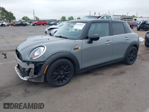 2015 MINI Hardtop 4 Door with VIN WMWXS5C52FT829699, listed as a IAAI auction lot 42078187 with 59,641 mi miles and . Bid and sale history available at DreamBid. Image 2.