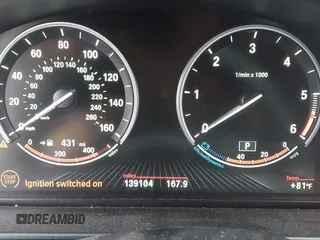 2014 BMW 5 Series 535d with VIN WBAXA5C58ED689864, listed as a IAAI auction lot 40983130 with 139,104 mi miles and . Bid and sale history available at carsss.com. Image 7.