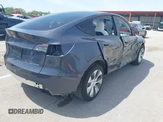 2023 Tesla Model Y Long Range z VIN 7SAYGDEE1PA158661, wystawiony jako IAAI lot #41983897 z przebiegiem 20 176 mil mil oraz . Historia ofert i sprzedaży dostępna na DreamBid. Obrazek 4.