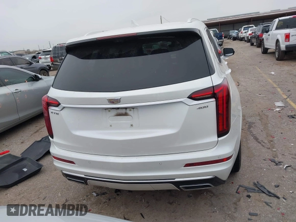 2021 Cadillac XT6 Premium Luxury z VIN 1GYKPCRSXMZ169206, wystawiony jako IAAI lot #41581841 z przebiegiem 64 789 mil mil oraz . Historia ofert i sprzedaży dostępna na DreamBid. Obrazek 16.