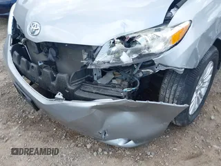 2015 Toyota Sienna XLE with VIN 5TDYK3DC7FS659864, listed as a IAAI auction lot 41958112 with 121,257 mi miles and . Bid and sale history available at DreamBid. Image 18.