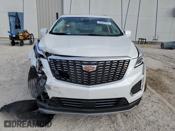 2024 Cadillac XT5 FWD Premium Luxury with VIN 1GYKNCRSXRZ745180, listed as a Copart auction lot 87627615 with 6,753 mi miles and Salvage Title. Bid and sale history available at carsss.com. Image 5.