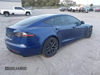 2023 Tesla Model S with VIN 5YJSA1E53PF518986, listed as a IAAI auction lot 41223046 with 22,204 mi miles and . Bid and sale history available at DreamBid. Image 4.