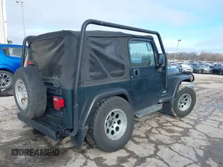 2005 Jeep Wrangler SE with VIN 1J4FA29S45P333916, listed as a IAAI auction lot 41214841 with 90,577 mi miles. Bid and sale history available at carsss.com. Image 4.