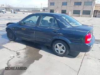 1999 Mazda Protege DX z VIN JM1BJ2229X0189290, wystawiony jako IAAI lot #41796448 z przebiegiem 281 528 mil mil oraz . Historia ofert i sprzedaży dostępna na DreamBid. Obrazek 3.