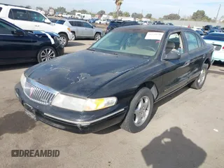 1997 Lincoln Continental with VIN 1LNLM97V5VY665410, listed as a IAAI auction lot 41239128 with 66,873 mi miles. Bid and sale history available at carsss.com. Image 18.