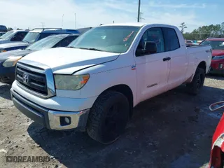2010 Toyota Tundra 2WD Truck with VIN 5TFRM5F1XAX005420, listed as a IAAI auction lot 41356210 with 253,604 mi miles. Bid and sale history available at carsss.com. Image 2.