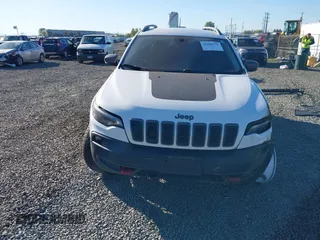 2021 Jeep Cherokee Trailhawk with VIN 1C4PJMBX9MD105888, listed as a IAAI auction lot 42065175 with 55,469 mi miles and . Bid and sale history available at DreamBid. Image 13.