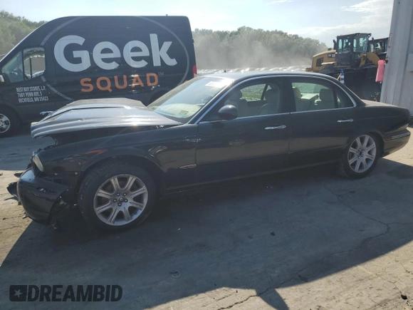 2004 Jaguar XJ with VIN SAJEA71C74SG02851, listed as a Copart auction lot 69056994 with 0 mi miles and Salvage Title. Bid and sale history available at carsss.com. Image 1.