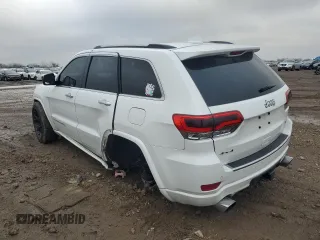 2014 Jeep Grand Cherokee Overland with VIN 1C4RJFCG7EC572298, listed as a Copart auction lot 83970004 with 104,861 mi miles and Salvage Title. Bid and sale history available at DreamBid. Image 2.