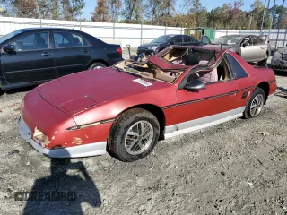 1986 Pontiac Fiero z VIN 1G2PF3794GP243268, wystawiony jako Copart lot #77030964 z przebiegiem 229 244 mil mil oraz Szkody całkowita. Historia ofert i sprzedaży dostępna na DreamBid. Obrazek 1.