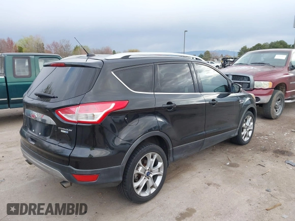 2015 Ford Escape Titanium with VIN 1FMCU9J96FUA27221, listed as a IAAI auction lot 41925276 with 180,758 mi miles and . Bid and sale history available at carsss.com. Image 4.