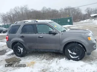 2012 Ford Escape XLS z VIN 1FMCU9C72CKA10130, wystawiony jako IAAI lot #41543233 z przebiegiem 168 552 mil mil oraz . Historia ofert i sprzedaży dostępna na DreamBid. Obrazek 13.