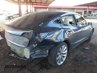 2018 Tesla Model 3 Long Range Battery with VIN 5YJ3E1EA3JF169132, listed as a IAAI auction lot 41678383 with 170,809 mi miles and . Bid and sale history available at DreamBid. Image 4.