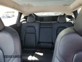 2023 Tesla Model Y Performance with VIN 7SAYGDEF7PF924355, listed as a Copart auction lot 47877055 with 64,663 mi miles and Salvage Title. Bid and sale history available at DreamBid. Image 10.