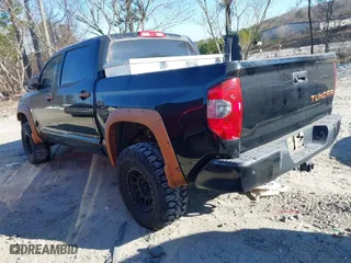 2014 Toyota Tundra 4WD Truck Platinum with VIN 5TFAW5F10EX400395, listed as a IAAI auction lot 41231404 with 152,445 mi miles. Bid and sale history available at carsss.com. Image 3.
