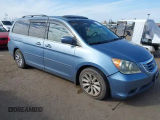 2008 Honda Odyssey Touring with VIN 5FNRL38868B047556, listed as a IAAI auction lot 41581617 with 220,436 mi miles. Bid and sale history available at carsss.com. Image 1.