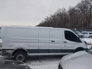 2016 Ford Transit Cargo z VIN 1FTYR2ZM7GKA78803, wystawiony jako IAAI lot #41364048 z przebiegiem 118 833 mil mil oraz . Historia ofert i sprzedaży dostępna na DreamBid. Obrazek 14.