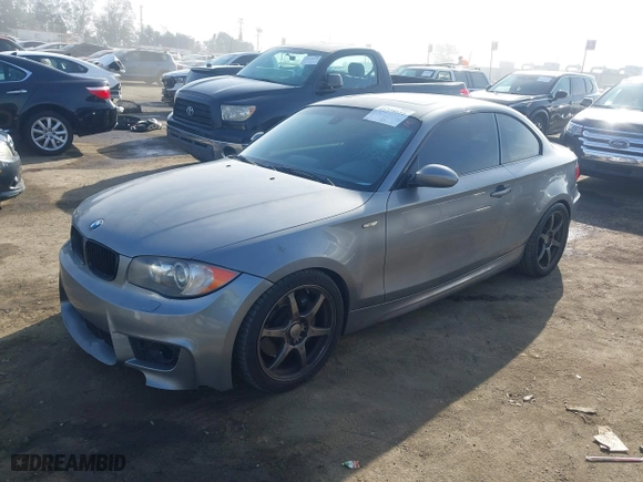 2009 BMW 1 Series 135i with VIN WBAUC73549VK80091, listed as a IAAI auction lot 41228611 with 128,515 mi miles. Bid and sale history available at carsss.com. Image 2.