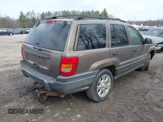 2001 Jeep Grand Cherokee Laredo with VIN 1J4GW48SX1C658610, listed as a IAAI auction lot 41831013 with 200,142 mi miles and . Bid and sale history available at DreamBid. Image 4.
