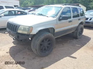 2004 Jeep Grand Cherokee Laredo with VIN 1J4GW48S34C354006, listed as a IAAI auction lot 42599812 with 258,004 mi miles and . Bid and sale history available at DreamBid. Image 2.