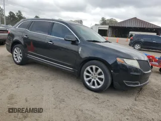 2014 Lincoln MKT with VIN 2LMHJ5FKXEBL53440, listed as a Copart auction lot 49063455 with 207,928 mi miles and Salvage Title. Bid and sale history available at DreamBid. Image 4.