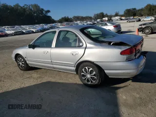 1998 Mercury Mystique z VIN 1MELM6534WK600653, wystawiony jako Copart lot #45148215 z przebiegiem 122 878 mil mil oraz Szkody całkowita. Historia ofert i sprzedaży dostępna na DreamBid. Obrazek 2.