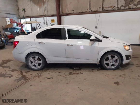 2015 Chevrolet Sonic LTZ with VIN 1G1JE5SB7F4121961, listed as a IAAI auction lot 41310464 with NaN miles. Bid and sale history available at carsss.com. Image 13.