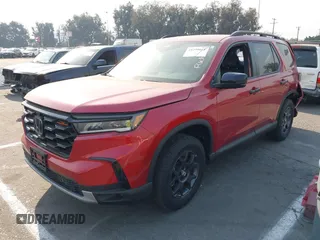 2023 Honda Pilot TrailSport with VIN 5FNYG1H65PB042687, listed as a IAAI auction lot 41259661 with 11,359 mi miles. Bid and sale history available at carsss.com. Image 2.