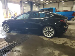 2019 Tesla Model 3 Mid Range z VIN 5YJ3E1EA4KF310792, wystawiony jako Copart lot #53031595 z przebiegiem 99 799 mil mil oraz Szkody całkowita. Historia ofert i sprzedaży dostępna na DreamBid. Obrazek 2.