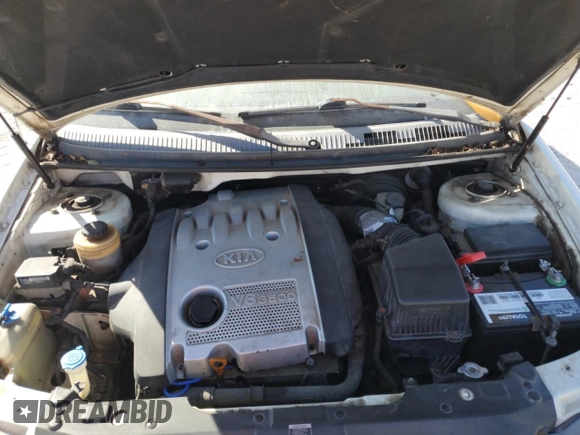 2004 Kia Sedona LX with VIN KNDUP131046585706, listed as a Copart auction lot 74973304 with 107,130 mi miles and Salvage Title. Bid and sale history available at carsss.com. Image 12.