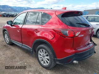 2014 Mazda CX-5 Touring with VIN JM3KE2CY3E0355296, listed as a IAAI auction lot 41688625 with 164,390 mi miles. Bid and sale history available at carsss.com. Image 3.