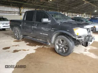 2015 Nissan Titan SL with VIN 1N6AA0ED1FN503994, listed as a Copart auction lot 39525224 with 104,353 mi miles and Salvage Title. Bid and sale history available at DreamBid. Image 4.