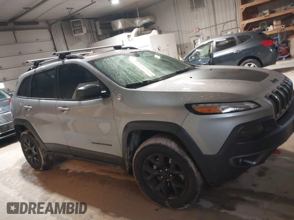 2014 Jeep Cherokee Trailhawk z VIN 1C4PJMBS4EW254963, wystawiony jako IAAI lot #42065845 z przebiegiem 187 356 mil mil oraz . Historia ofert i sprzedaży dostępna na DreamBid. Obrazek 13.
