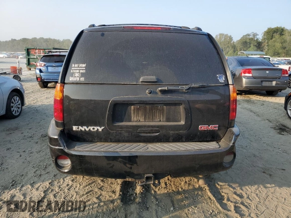 2004 GMC Envoy SLT with VIN 1GKDT13S942407244, listed as a Copart auction lot 70995064 with 162,676 mi miles and Salvage Title. Bid and sale history available at carsss.com. Image 6.