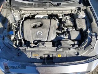 2021 Mazda CX-5 Grand Touring with VIN JM3KFBDM9M0490239, listed as a Copart auction lot 43306975 with 47,010 mi miles and Salvage Title. Bid and sale history available at carsss.com. Image 12.