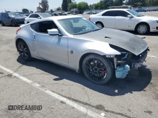 2014 Nissan 370Z Nismo with VIN JN1AZ4EH8EM633218, listed as a Copart auction lot 57296165 with Not provided miles and Salvage title. Bid and sale history available at DreamBid. Image 4.