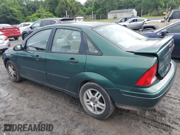 2000 Ford Focus SE with VIN 1FAFP3433YW354797, listed as a Copart auction lot 61430265 with 165,202 mi miles and Salvage title. Bid and sale history available at DreamBid. Image 2.
