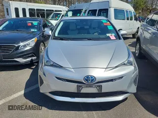 2018 Toyota Prius Two with VIN JTDKARFU8J3064582, listed as a IAAI auction lot 42143951 with 74,689 mi miles. Bid and sale history available at carsss.com. Image 1.