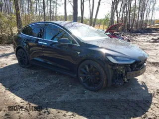 2020 Tesla Model X Long Range with VIN 5YJXCAE20LF249801, listed as a IAAI auction lot 41824645 with 118,270 mi miles. Bid and sale history available at carsss.com. Image 1.