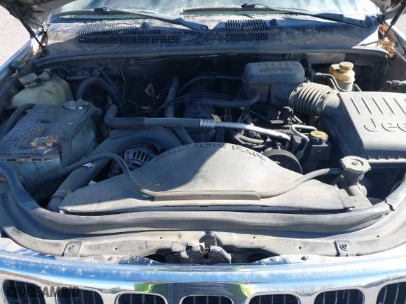 2003 Jeep Grand Cherokee Laredo with VIN 1J4GW48S03C567770, listed as a IAAI auction lot 42028727 with 245,728 mi miles. Bid and sale history available at carsss.com. Image 10.