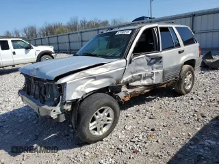 1997 Jeep Grand Cherokee Laredo with VIN 1J4GZ58S5VC561060, listed as a Copart auction lot 52098315 with 267,245 mi miles and Salvage title. Bid and sale history available at DreamBid. Image 1.