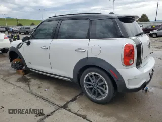 2015 MINI Countryman S with VIN WMWZC5C58FWP46931, listed as a Copart auction lot 59183495 with 105,731 mi miles and Salvage title. Bid and sale history available at DreamBid. Image 2.