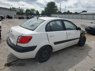 2009 Kia Rio LX with VIN KNADE223996526222, listed as a Copart auction lot 69976484 with 318,702 mi miles and Salvage Title. Bid and sale history available at DreamBid. Image 3.