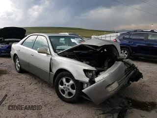 1999 Lexus ES 300 z VIN JT8BF28G3X5063996, wystawiony jako Copart lot #54093095 z przebiegiem 216 576 mil mil oraz Szkoda całkowita • Salvage title. Historia ofert i sprzedaży dostępna na DreamBid. Obrazek 13.