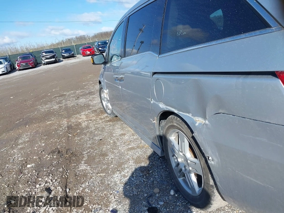 2011 Honda Odyssey Touring with VIN 5FNRL5H92BB049901, listed as a IAAI auction lot 41985224 with 101,957 mi miles and . Bid and sale history available at DreamBid. Image 6.